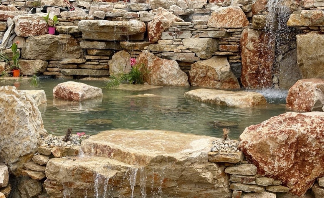 Stepping stones crossing the wetland filtration zone — Lisbon Natural Pool Oasis